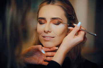 Smokey Eyes Look on a Model Done by a Makeup Artist. Lady having her looks changed through...