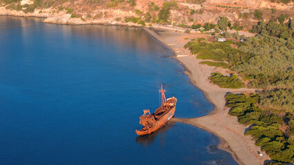greece peloponnese region sunken ship stuck on the beach rusty old metal formerly used for...