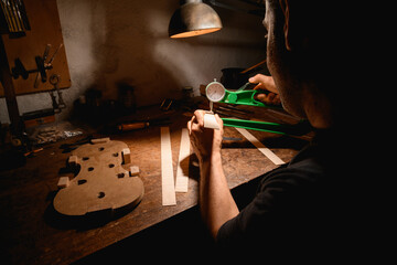 Luthier using his tools