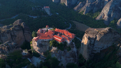 Greece Meteora region unique mountain formations and monasteries taken with drone at sunrise