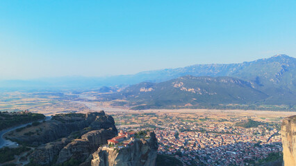 Greece Meteora region unique mountain formations and monasteries taken with drone at sunrise