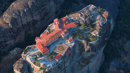 Greece Meteora region unique mountain formations and monasteries taken with drone at sunrise