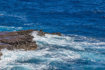 Dramatic Ocean crashing wave Hawaii at Makapu Point