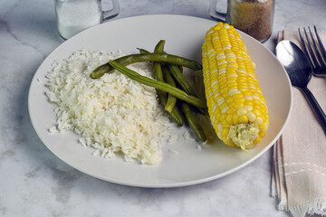 white rice with green beans and corn