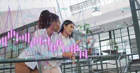 Financial data and analytics image over diverse businesswomen discussing in modern office