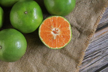 Fresh orange fruits on dark background. Citrus juicer. Summer tropical fruits. Food concept....
