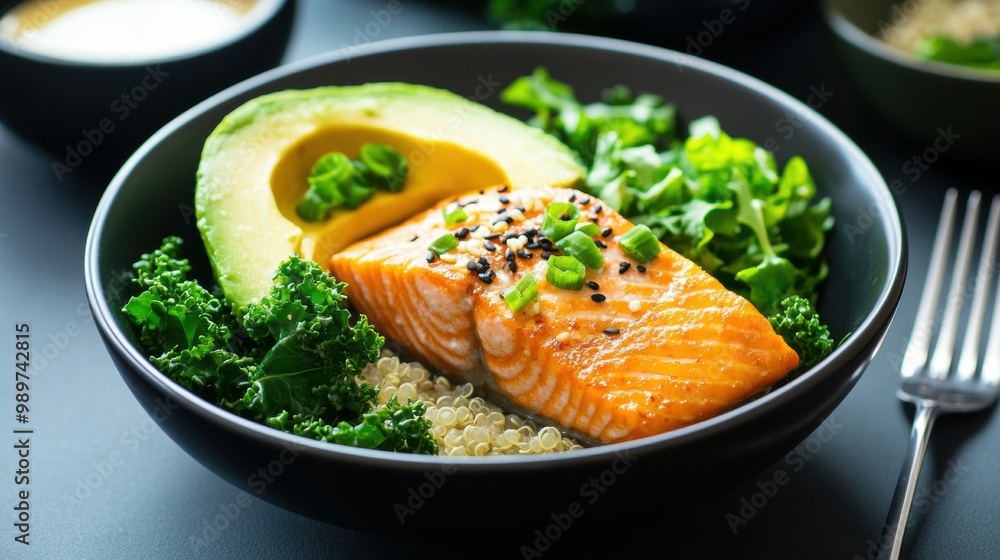 Wall mural healthy salmon bowl with avocado and greens