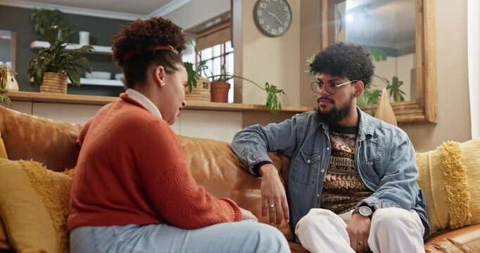 Couple, talking and fight on sofa for conflict, argument and discussion in home. Sad man, woman or upset in living room for confession, problem solving or reconcile with partner in marriage for love