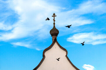 Wooden Russian onion dome with a cross under