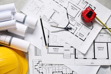 Different engineering drawings and tools on table, flat lay