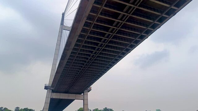 Vidyasagar setu or Vidyasagar bridge of Kolkata city shot from below while moving under it. This bridge is symbolic to metro city Kolkata and west bengal.