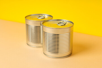 Can with food, on a yellow background.