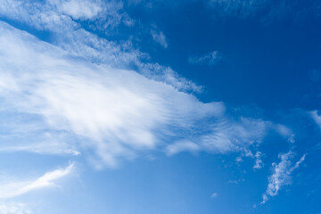 blue sky with wispy white clouds