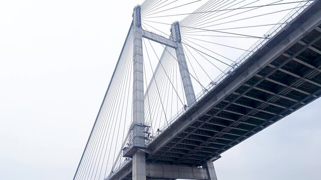 Vidyasagar setu or Vidyasagar bridge of Kolkata city shot from below while moving under it. This bridge is symbolic to metro city Kolkata and west bengal.