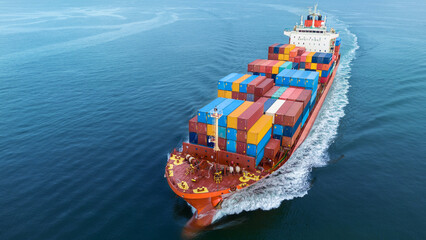 Cargo container ship carrying container and running out international container port customs...
