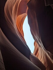 Orange wavy rocks in desert with clear blue sky