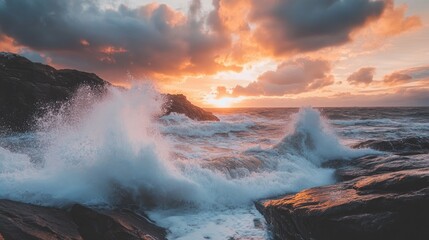 Waves crashing over a rocky coastline at dawn, with dramatic clouds in the sky.