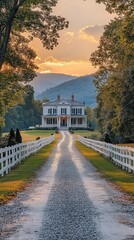 Obraz premium Gravel driveway leading to classic white southern style home at sunset