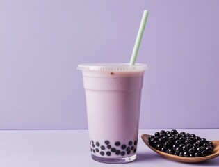 Purple Bubble Tea with Tapioca Pearls and Straw on Purple Background