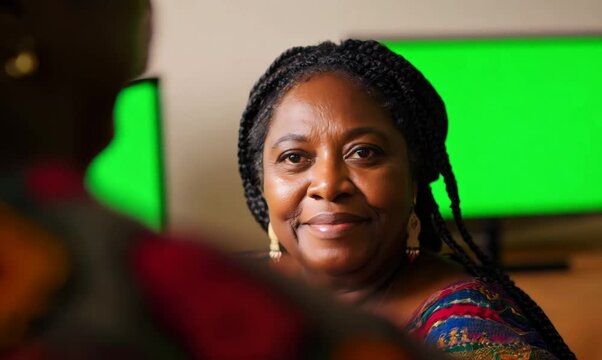 Malawian Woman Enjoying Television in Cozy Living Room