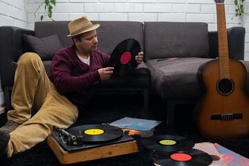 man reviews vinyl records, vintage photography