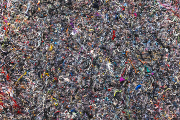 Recycled textile insulation fabric made of colorful fibers, background photo