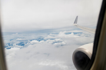 Looking at the clouds through airplane window