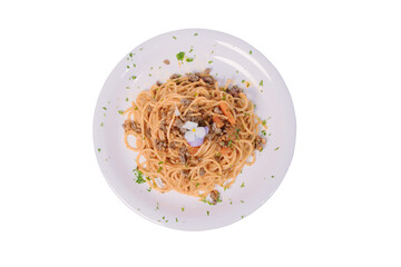 A plate of spaghetti with a classic meat sauce, topped with a small flower and chopped parsley.