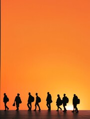 Fototapeta premium Silhouettes of People Walking Into the Sunset, capturing a moment of transition, hope, and new beginnings. This image conveys themes of community, unity, and progress.