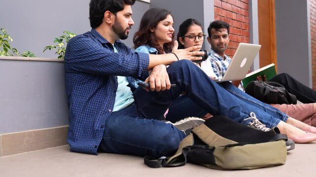 A group of Indian friends relaxing in a cozy corner,chatting ,learning and sharing ideas on a new concept  in a supportive environment
