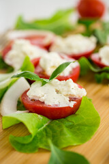 tomato wedges with cottage cheese filling and garlic, spicy appetizer