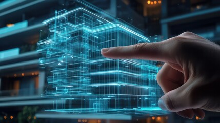Fototapeta premium Hand pointing at digital virtual reality modern commercial building hologram. Real estate for investment building technology concept.