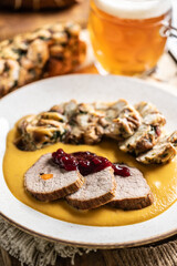 Beef fillets from sirloin steak with traditional Czech sauce, Karlovy Vary dumpling with cranberries and good Czech beer