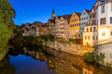 Night shot of historic half-timbered buildings at the riverfront in Tübingen, Germany