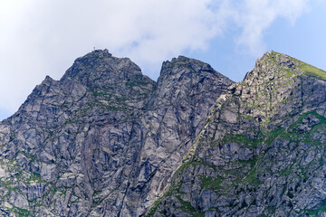 Looking up mountain peaks with rocks and cliffs at mountain resort of Meran Merano 2000 on a summer day. Photo taken July 18th, 2024, Meran Merano, Italy.