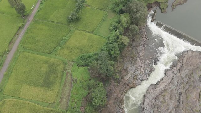 Raw footage Aerial view of river with Dam near agriculture field Located in Mayadevi Temple in Dang Gujarat.  