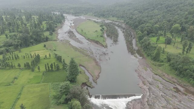 Raw footage Aerial view of river with Dam near agriculture field Located in Mayadevi Temple in Dang Gujarat.  