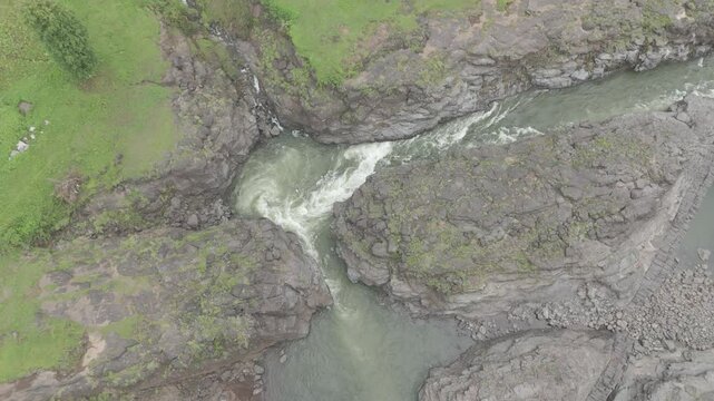 Raw footage Aerial view of river with Dam near agriculture field Located in Mayadevi Temple in Dang Gujarat.  