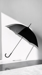 Fototapeta premium black umbrella in white room minimalist photography