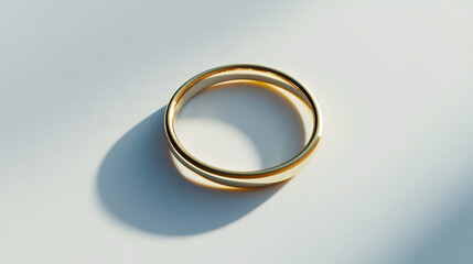 gold wedding ring on white background  - minimalist photography