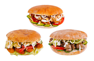 Three delicious pita sandwiches with various fillings are lying on white background