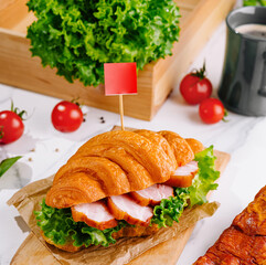 Delicious croissant being served as a sandwich for lunch