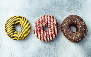 Sweet glazed colorful donuts . Top view