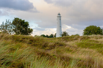 The white lighthouse with sunset skyline, The south tower (Zuidertoren) or water tower, Schiermonnikoog is a municipality and national park in the Northern Netherlands, One of the West Frisian Islands