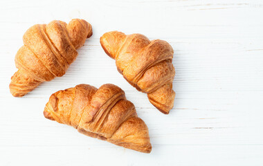 Group of sweet croissant . French morning breakfast . Top view
