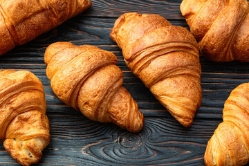 Group of sweet croissant . French morning breakfast . Top view