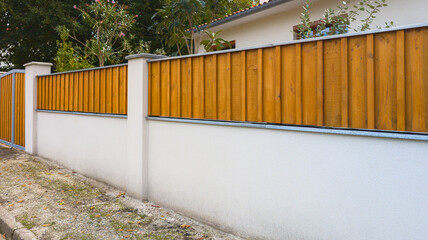 fence high wooden gate facade in street view outdoor home door entrance