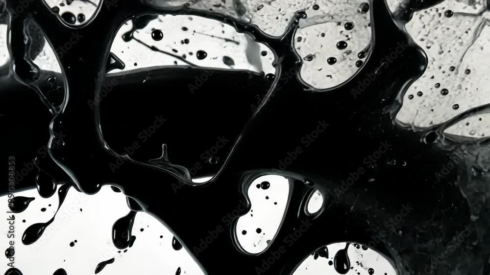 Poster black ink swirls and drips in a mesmerizing pattern