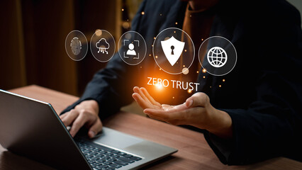 Zero trust security concept, Businessman using laptop with zero trust icons on virtual for business information security network. Ai technology