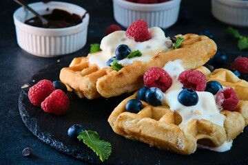 still life Belgian waffles on dark background